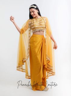 Mustard Yellow Color Dhoti Skirt Set – Panache Haute Couture Satin Dhoti Skirt, Dhoti Frock Dress, Navratri Reception Set With Traditional Drape, Traditional Drape Sets For Reception And Navratri, Dhoti Skirt Outfits With Cape, Tissue Silk Sharara For Diwali With Traditional Drape, Silk Sharara For Navratri Reception, Silk Sharara For Reception And Navratri, Silk Sets For Navratri Reception