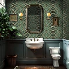 a bathroom with green wallpaper and a white toilet sitting next to a sink in front of a mirror