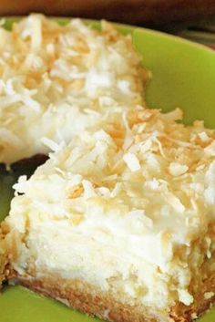 two pieces of coconut cream pie on a green plate