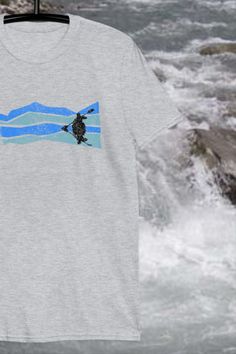 Adventure kayak tshirt. Super cool mountain river design for the soul outdoor adventurer. Kayak t shirt, kayak gifts, explore shirt, canoe shirt, Colorado tshirt, Montana shirt, wanderlust shirt, adventure shirt, outdoor shirt graphic tees//adventure travel//aesthetic travel//anniversary gift ideas for him//birthday gifts for boyfriend//river//fishing//kayaking//paddle Short Sleeve Graphic Tee For Outdoor Activities, Graphic Tee Shirt With Short Sleeves For Outdoor Activities, Pre-shrunk Tri-blend T-shirt For Outdoor Activities, Sporty Screen Print Tops For Outdoor Activities, Outdoor Shirt With Screen Print And Relaxed Fit, Relaxed Fit Screen Print Shirt For Outdoor, Relaxed Fit Shirt With Screen Print For Outdoor, Graphic Tee Shirt With Screen Print For Outdoor, Outdoor Relaxed Fit Screen Print Shirt