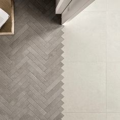 an overhead view of a bathroom with herringbone tile