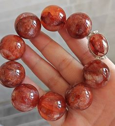 Material: Natural Red Hematoid Lepidocrocite Quartz beads  size :  21-22mm   quantity: one strand 6mm approx 29 pcs one strands 7mm approx25 pcs one strands 8mm approx 22 pcs one strands 9mm approx 21pcs one strands 10mm approx 19 pcs one strands 11mm approx 18pcs one strands 12mm approx 16 pcs one strands 13mm approx 16 pcs one strands 14mm approx 15 pcs one strands 15mm approx 14pcs one strands 16mm approx 14 pcs one strands 17mm approx 13pcs one strands 18mm approx 13pcs one strands 19mm appr Red Crystal Bracelet With Natural Stones, Red Natural Stones Crystal Bracelet, Red Gemstone Beaded Bracelets With Round Beads, Beaded Round Carnelian Bracelets, Beaded Round Carnelian Bracelet, Red Agate Gemstone Beaded Bracelets, Large Beaded Round Crystal Bracelet For Gift, Handmade Carnelian Bracelet, Amber Beaded Bracelets With Round Beads