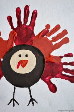 a handprinted turkey is shown with red paint on it