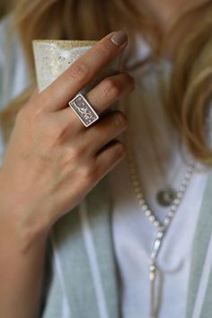 * Silver Rectangle Statement Signet Ring, Persian Calligraphy * The text on the ring is "که تو جانی و جهانی" which means you are my world and my life. ooo SPECIFICATIONS: * Dimension: 2.2 * 1.2 cm (0.9 * 0.5 in) * Material: 925 Sterling Silver, Oxidized Silver * Handmade * Size: Select from the drop-down menu * High-quality materials and attention to detail ooo PACKAGING: * All orders will be wrapped in a complimentary Zargoon Signature gift box and ribbon. * Personalized Card (optional) * Order Unique Rectangular Engraved Rings, Handmade Rectangular Sterling Silver Engraved Ring, Stamped Rectangular Jewelry For Wedding, Rectangular Stamped Jewelry For Wedding, You Are My World, Persian Calligraphy, Silver Signet Ring, Unisex Ring, Oxidized Silver