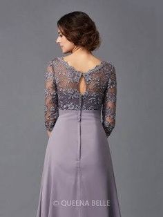 a woman in a long purple dress with lace on the top and sleeves, back view