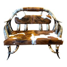 a cow hide chair with horns on it