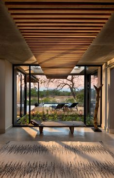 an open room with large glass doors leading to the outside