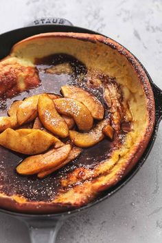 some food is cooking in a skillet on the stove top and it looks like they have been fried