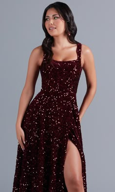 In deep burgundy red, this long sequin prom dress is simply dazzling. Uniquely gorgeous for prom, fancy formals, and other black-tie events, this long designer dress is constructed of soft velvet fabric with sparkly sequins from the neckline to the floor. Supportive shoulder straps lead to the deep v-back of this elegant long formal dress, while the figure-flattering long skirt flows to the floor in an a-line shape. Exclusively at PromGirl, in misses and plus sizes, this elegant burgundy red lon Dark Red Prom Dress Sparkle, Sparkly Burgundy Dress, Deeksha Core, Glittery Long Dress, Maroon Prom Dress Burgundy, Red Sparkle Dress, Stage Performance Outfits, Burgundy Sequin Dress, Maroon Prom Dress