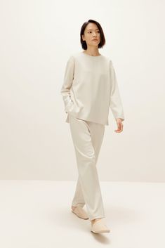 A timeless loungewear set you don’t want to miss! Our Boundless Soft Tapered Pants exude ease and simplicity. The relaxed yet elegant shape is perfect for lounging and for running errands — exactly what you need to unwind after a long day. Details Materials & Care Shipping & Returns • Tapered fit, front pockets, and a smooth drape for a flattering fit.• Constructed in a cotton blend, this relaxed loungewear feels soft against the skin; slipping them on is delightfully soothing! Size M is 39" in Comfy Airport Outfit, Embroidered Pajamas, White Lounge, Mock Neck Tank Top, Everyday Jacket, Cold Weather Outfit, Backless Long Dress, Fleece Pajama Pants, Split Hem Dress