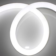 two white circular lights sitting on top of a table