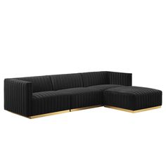 a black couch with gold legs on a white background