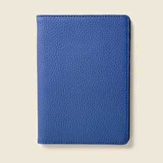 a blue leather passport case on a white background with an empty space for the text