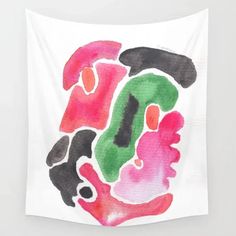 a white wall hanging with an abstract painting on it