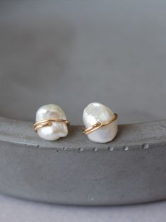 Freeform super cute and dainty stud earrings, featuring genuine little pearls, wire wrapped in gold filled or sterling silver wire. $25. Perfect everyday stud earrings for your cartilage and earlobe piercing. #studearrings #pearlearrings #studs #pearlstuds #bridalstudearrings @wirewrappedearrings #pearljewelry Delicate Gold Wrap Earrings For Gift, Delicate Gold Wrap Earrings, Gold-filled Wrap Earrings As Gift, Delicate Gold Wrap Earrings For Pierced Ears, Minimalist Gold Pearl Earrings In Sterling Silver, Minimalist 14k Gold Filled Wrap Earrings As Gift, Elegant Adjustable Yellow Gold Wrap Earrings, Elegant Yellow Gold Adjustable Wrap Earrings, Gold Dainty Wrap Earrings As Gift