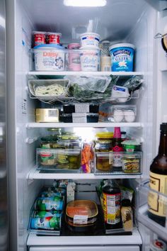 an open refrigerator filled with lots of food