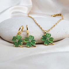 Gold Filled Clover Necklace, 4 Leaf Necklace,  Luck Necklace, Four-Leaf Clover, Shamrock Jewelry, Shamrock Necklace, Christmas Gift, Jade   Size & Material & Other Details ∙ Clover Pendant Size: 12mm x12mm ∙ Material: 14K Gold Filled over Brass and C Class Jade ∙ The necklace comes with 2 inch extender. If you want to remove it, please let us know. ∙ For Earrings:  ∙ Hoop Size: 12mm  Turnaround Time: * NEXT DAY * We will ship it the next business day if orders are placed between 8 AM-4 PM on wee Shamrock Jewelry, Shamrock Necklace, Luck Necklace, Elegant Gift Wrapping, Good Luck Necklace, Clover Design, Clover Pendant, Simple Gift Wrapping, Clover Earrings