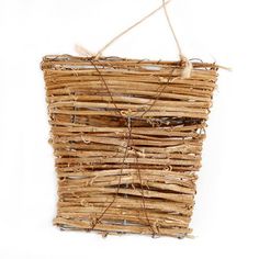 a basket made out of sticks and rope on a white background with twine string