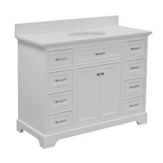 a white bathroom vanity with drawers and a sink