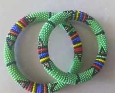 Beaded Bracelets | African Maasai Beaded Bracelets | African Jewelry | Zulu Beaded Bracelets | Ethnic Bracelets | Gift For Her | A Set Of Two These superbly crafted Zulu beaded bracelets are made of fine beads.The price is for a set of two bracelets.Main Color - Green.Size - Standard measurement is 7 - 8 inches.For smaller or larger bracelets please contact me.Available in different colors.Feel free to send me a convo or e-mail for any clarification.Thank you for visiting... Traditional Beaded Bangle Bracelets With Tiny Beads, Traditional Beaded Bangle Bracelet With Tiny Beads, Bohemian Handmade Bangle With Round Beads, Bohemian Bangle With Colorful Beads, Traditional Tiny Beaded Bangle Bracelets, Handmade Bohemian Bangle With Round Beads, Traditional Bangle Bracelet With Tiny Beads, Artisan Green Bangle Bracelet, Green Handmade Festival Bracelets