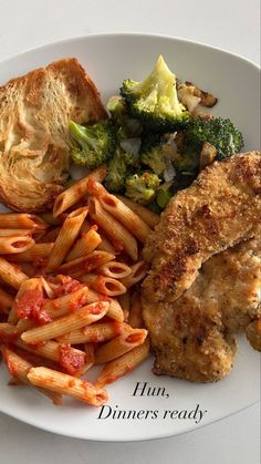 a white plate topped with pasta, meat and veggies