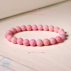 "Pink Conch Stone Bracelet 8 mm Round Crystals Bracelet Stretch Gemstone Bracelet Meditation Triple Protection Yoga Bracelet +Gift Bag For Her Material : Pink Conch, Natural Stones, Natural Crystal, Raw Stone Quality: AAA+ Length: fit for 6.3 ~ 7.3 inches wrists Beads size: 8mm + Free gift bag Your bracelet will arrive beautifully packaged in a gift bag ,The bracelet is made on non fray stretch nylon cord for strength and flexibility.  All beads are carefully selected. When you put on and off yo Pink Crystal Gemstone Bracelet For Gift, Pink Spiritual Crystal Bracelet For Gifts, Pink Spiritual Crystal Bracelet With Natural Stones, Dainty Pink Natural Stone Bracelet, Pink Gemstone Bracelet, Adjustable Rose Quartz Stretch Bracelet, Spiritual Style, Meditation Crystals, Rough Crystal, Yoga Bracelet