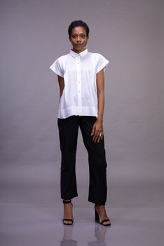 White organic cotton button down drop shoulder woman's top with magyar sleeve, shirt collar and textured back yoke. this is an excellent gift for a loved one in the family like your mother , daughter or someone close. Geometric folds are created on fabric using the technique of Shadowfolding, which is made from a single three step process. The flexible property of the organic cotton allows pleats to be folded to augment and give a dimensionality not present in a flat surface; and the translucent Effortless Cotton Shirttail Hem Top, Effortless Cotton Top With Shirttail Hem, Cotton Blouse With Relaxed Fit For Everyday, Relaxed Fit Cotton Blouse For Everyday, Effortless Cotton Blouse With Shirttail Hem, Relaxed Fit Cotton Blouse For Daywear, Effortless Relaxed Fit Collared Tops, Effortless Collared Relaxed Fit Tops, Everyday Relaxed Fit Cotton Blouse