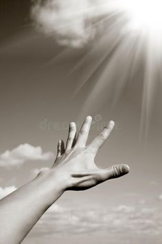 a hand reaching up to the sky with clouds in the background royalty images and clippings