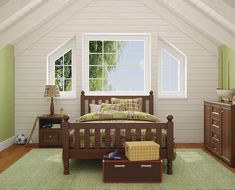 a bed room with a neatly made bed next to a dresser and chest of drawers