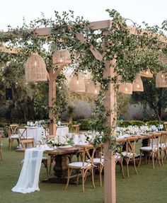 an outdoor wedding setup with tables and chairs