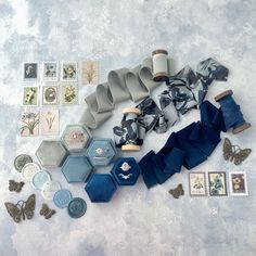 some different items are laying out on the table together, including blue and white paper