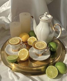 tea set with lemons and limes on a tray