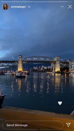 an image of a bridge over water at night