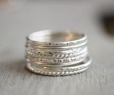 Beautiful mix of .925 sterling silver stacking rings. Slim stackable rings. Set of 8. Also available in 14k yellow and rose gold filled. 2 smooth bands, 2 hammered bands, 2 twist bands, and 2 faceted bands If you don't see your size please feel free to message me. All orders ship in a gift box. If you are ordering multiple items and want them boxed separately, please let me know in the notes at checkout. I ship via USPS. Please review the estimated delivery date and processing times. Processing Rings Simple Silver, Twisted Band Ring, Gold Amethyst Ring, Ring Spacer, Stackable Rings Silver, Rose Gold Quartz, Sterling Silver Stacking Rings, Stacking Ring Set, Silver Stacking Rings