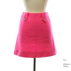 Late 60s or Early 70s "Home Sewn" Womens hot pink wool acrylic blend lowered waist hip-hugger style skirt having a center back zipper closing. Dual tabs on the front and back are held in place by a single silver metal button. Inside is lined by white silky acetate fabric. This mini-length garment measures 17inches from waist to hem. Fits: 28Waist, 34Hip Our item # 389004-A26607