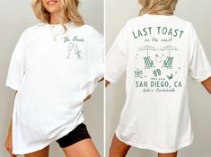 a woman wearing a white shirt with the words, last toast and san diego written on it