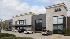 several cars are parked in front of the building