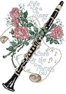 a cross stitch pattern with roses and a flute