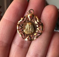 This is a beautiful vintage, Italian Virgin Mary/Theotokos medal made from 18k gold. Absolutely gorgeous details, hallmarked on the back. As always, Mary's goodness and light shine through. More photos and products can be found on Instagram @little_bell_vintage Please look at all the photos thoroughly. Purchasing implies you have studied the photos, asked me questions, and agree with the items condition, which may show signs of wear. Some antique and vintage items are anywhere from 20-150 years old, and may have scratches and other imperfections. Gold Spiritual Jewelry And Charms For Wedding, Spiritual Yellow Gold Wedding Jewelry And Charms, Gold Spiritual Locket Jewelry And Charms, 14k Gold Medallion For Commemoration, Gold Virgin Mary Medallion Jewelry, Vintage Miraculous Medal Necklace, Vintage Round Miraculous Medal Necklace, Vintage Miraculous Medal Necklace Gift, Vintage Miraculous Medal Pendant Jewelry