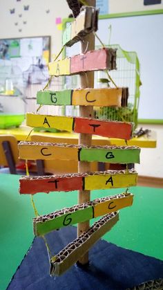 a wooden christmas tree with letters on it