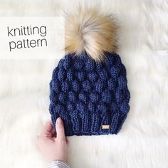 a knitted hat with a pom - pom on top and text overlay that reads knitting pattern