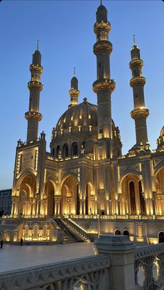 an ornate building lit up at night