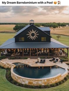 an aerial view of a large house with a pool and hot tub in the yard