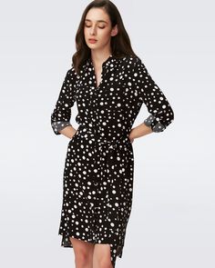 Cut from a soft crepe, the Prita has an effortless feel with a tailored look. Relaxed in drape, this shirt dress has fabric-covered buttons down the center, long sleeves that cinch at the cuff, a high-low hem, and a classic collar. Highlight the waist with a belt, or wear the silhouette as an easy shape like Diane does. LENZING™ ECOVERO™ Viscose fibers are created from renewable wood sources and manufactured using less water and emitting less CO2. Better for the environment, better for your styl Elegant Collared Rayon Dress, Elegant Rayon Shirt Dress For Daywear, Chic Rayon Shirt Dress For Daywear, Knee-length Shirt Dress With Roll-up Sleeves For Daywear, Viscose Knee-length Shirt Dress For Work, Viscose Button-up Shirt Dress For Work, Chic Long Sleeve Rayon Shirt Dress, Long Sleeve Rayon Dress For Work, Fall Button-up Viscose Dress