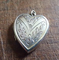 Edwardian beautiful sterling silver floral engraved heart locket   excellent vintage condition  missing plastic inserts Silver Heart Locket Necklace Collectible, Vintage Engraved Sterling Silver Locket Necklace, Vintage Engraved Heart Locket Necklace, Victorian Silver Heart Pendant Locket Necklace, Heart-shaped Antique Silver Locket Necklace, Mermaid Artwork, Heart Locket, Locket Necklace, Locket