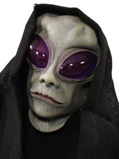 an alien with purple eyes is wearing a black hood