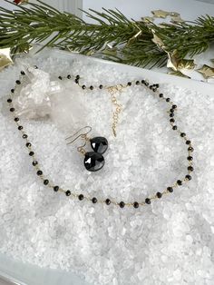 This is simple, beautiful necklace is comprised of 3mm Faceted Black Spinel hand-wrapped into a rosary style chain. Finished off with dangle of gold beads. Necklace length 16" with a 2" extender. Rosary chain is vermeil. All other components are gold filled. Black Beaded Lariat Necklace Gift, Black Beaded Chain Lariat Jewelry, Black Beaded Dangle Necklace For Gift, Elegant Black Beaded Dangle Necklace For Gift, Gold Crystal Necklace With Black Beads As Gift, Gold Crystal Necklace With Black Beads For Gift, Gold Beads Necklace, Rosary Chain Necklace, Rosary Chain