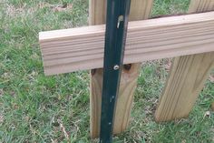 a close up of a wooden fence post