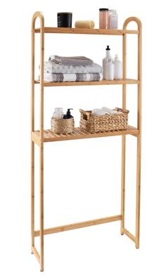 a bamboo shelf with towels and soaps on it