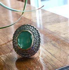 this ring is GORGEOUS!! you will love it! Really large Antique or vintage (looks like Victorian, but could be later) ring set with one big (approx 18x15mm -8-8.5CT by formula) Green Beryl - Emerald and natural old cut diamonds -3 rows! each approx 1.2-1.3mm. total carat weight of emerald and diamonds approx 9CTW+ it is hallmarked on the band 14k and made of solid yellow gold! also the bezel setting for the emerald made of solid 14k yellow gold. all of the diamonds set into solid 925 Silver (the Collectible Round Emerald Ring, Vintage Oval Emerald Ring With Halo Setting, Unique Dome Ring With Gemstone For Anniversary, Handmade Vintage Emerald Ring For Anniversary, Heirloom Emerald Ring With Rose Cut Diamonds, Vintage Handmade Emerald Anniversary Ring, Vintage Silver Emerald Ring With Rose Cut Diamonds, Vintage Cabochon Emerald Ring For Anniversary, Vintage Emerald Cut Emerald Ring With Bezel Setting